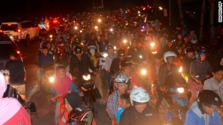 Motorists in Cilacap, Indonesia, are stuck in traffic as they try to reach higher ground amid fears of a tsunami after an earthquake. But a tsunami warning was canceled.