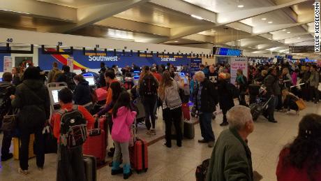 Passengers wait to learn if their flights will leave Atlanta on Monday. 