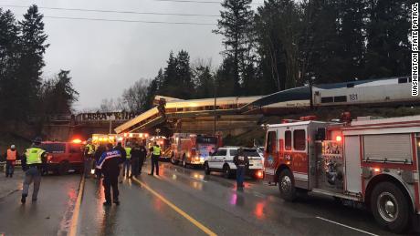 An Amtrak train car derailed and is dangling on to Interstate 5 in Pierce County, Washington, according to the Washington State Department of Transportation&#39;s twitter. All southbound lanes of the I-5 are closed due to the derailment. 