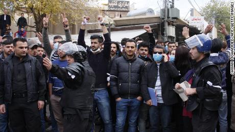 Iraqi Kurdish protesters shout slogans in Sulaymaniyah on December 19.
