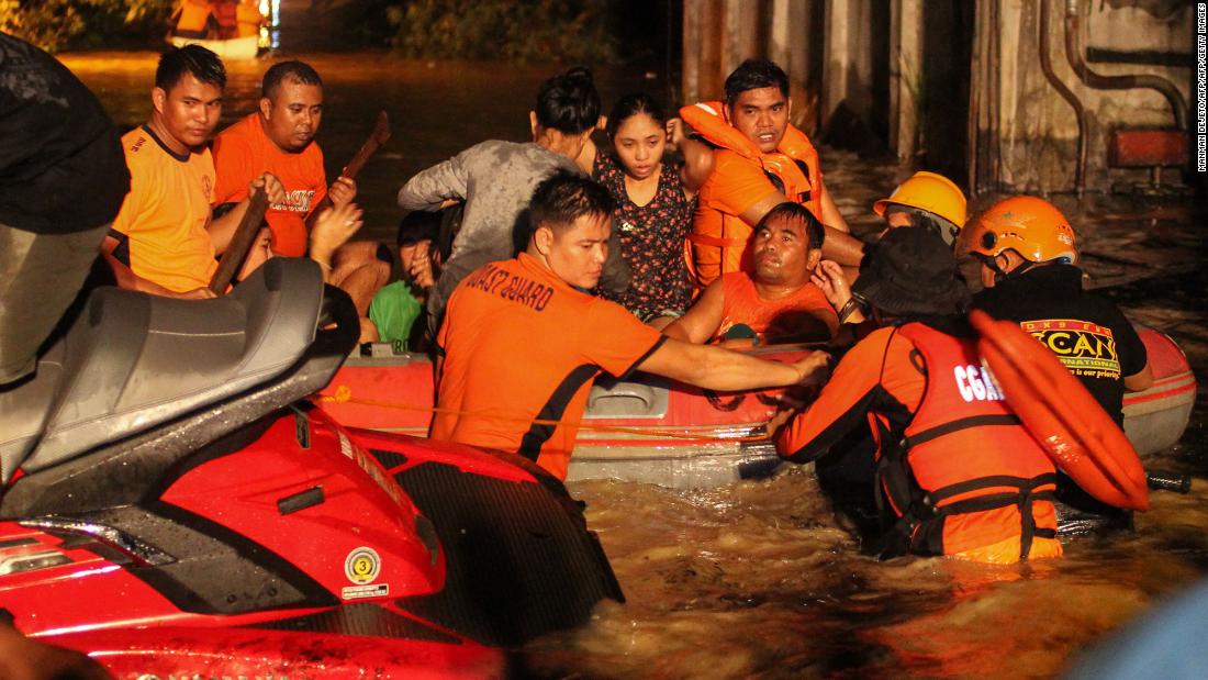 Evacuations are underway in flood-affected areas of Davao on December 23. At least 30,000 people have gone to shelters on the island of Mindanao, an official says.