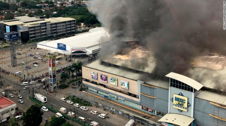 A fire rages at the NCCC mall in Davao City in the Philippines on Saturday.