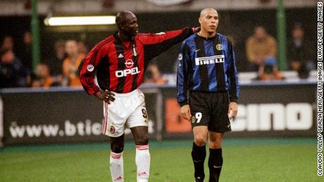 Weah in the red and black of AC Milan consoles Ronaldo of Inter Milan after his sending off during a Serie A match at the San Siro in Milan, Italy. 