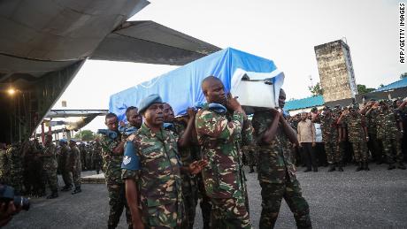 Tanzanian soldiers carry the coffin of a UN peacekeeper in the Tanzanian capital of Dar es Salaam on December 11.
