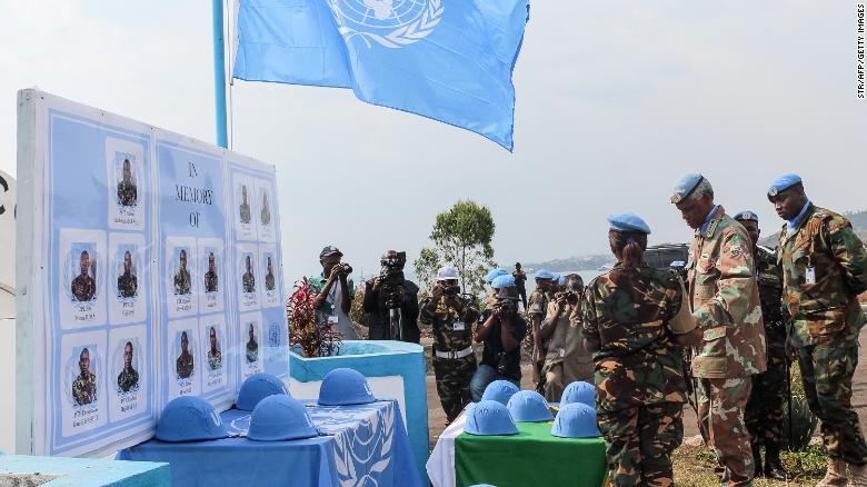 Helmets of Tanzanian peacekeepers slain by rebels are displayed during a tribute ceremony in the Congolese city of Goma.