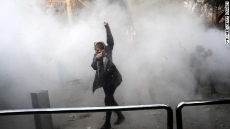 Tear gas is seen during protests at the University of Tehran on December 30.