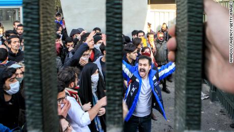 People gather to protest over high cost of living in Tehran.