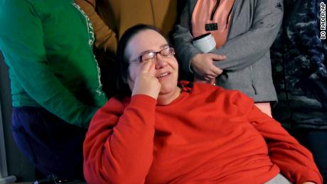 Lisa Finch, surrounded by family members reacts to the killing of her son Andrew Finch.