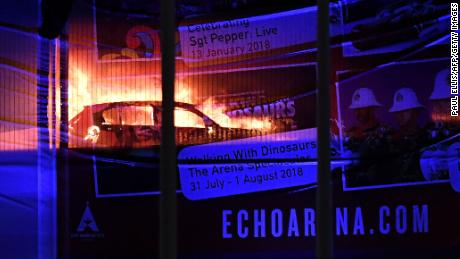 A massive blaze engulfs vehicles parked at a multi-storey car park near the Echo Arena, at the waterfront in Liverpool, England on Sunday afternoon. 
