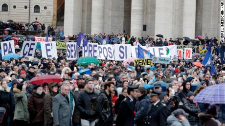 Faithful held placards reading &quot;Pace e&#39; semipro possible&quot; (Peace is always possible) on Monday.