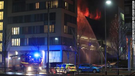 Emergency services at a blaze at a multi-storey car park at the Echo Arena on Liverpool&#39;s waterfront. 