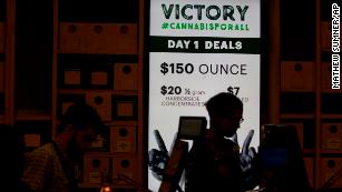 A sign advertises deals at Harborside marijuana dispensary on Monday. 