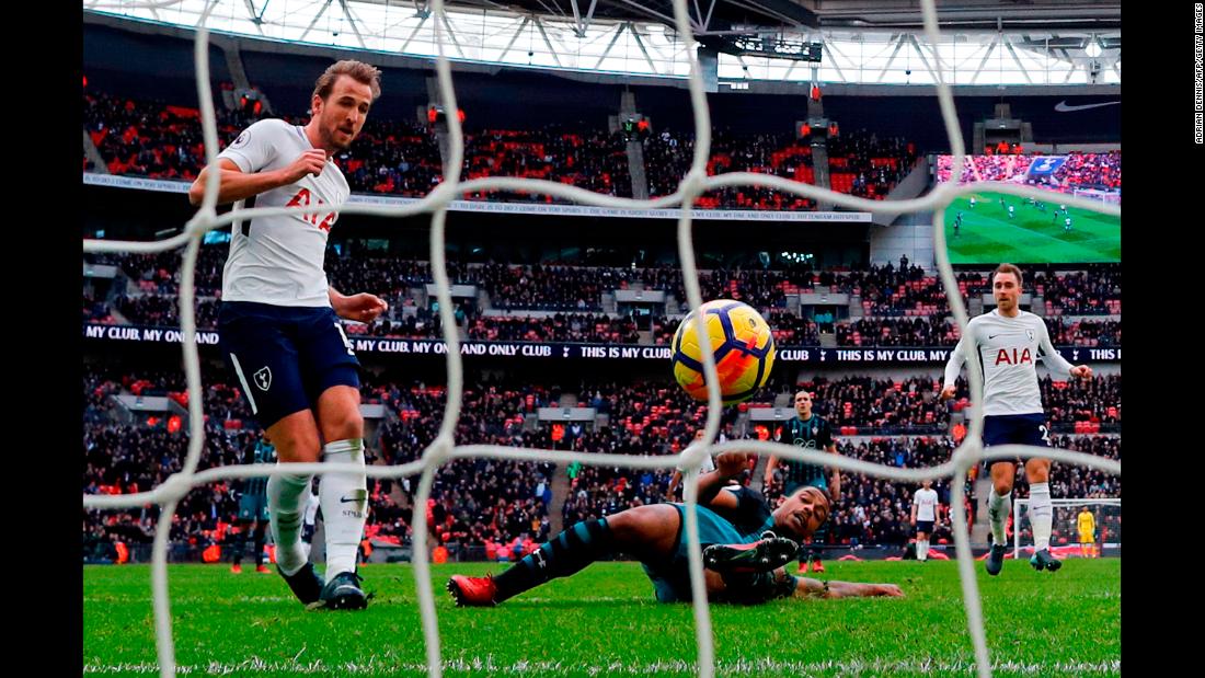 Tottenham striker Harry Kane, left, scores his second of three goals during a Premier League match in London on Tuesday, December 26. Tottenham defeated Southampton 5-3, and Kane broke the league record for most goals scored in a calendar year (39). 