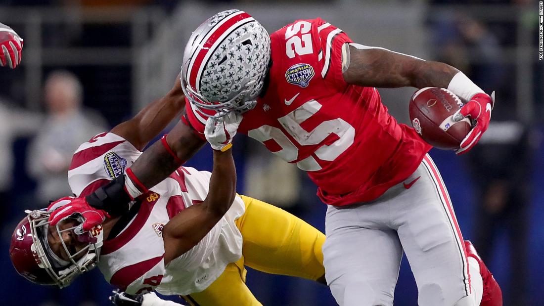 Ohio State running back Mike Weber stiff-arms USC&#39;s Isaiah Langley during the Cotton Bowl Classic on Friday, December 29. Ohio State won 24-7 in what was a matchup of two conference champions.