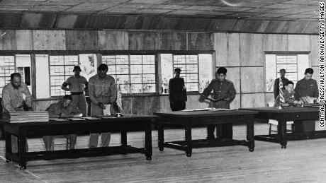 Lieutenant General William K Harrison and Senior Communist Delegate General Nam Il during the signing of the Korean Armistice in Panmunjom on July 27, 1953.