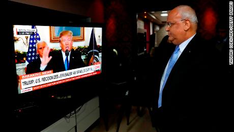 Chief Palestinian negotiator Saeb Erekat watches a speech given by US President Donald Trump on December 6 during which Trump recognized Jerusalem as Israel's capital.