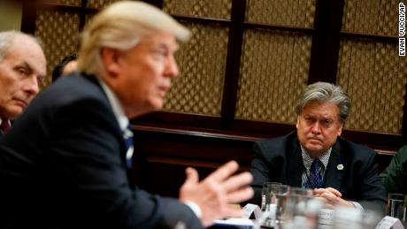 White House Chief Strategist Steve Bannon listens at right as President Donald Trump speaks during a meeting on cyber security in the Roosevelt Room of the White House in Washington, Tuesday, January 31, 2017.