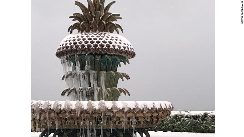 A metal pineapple tops a fountain in Charleston.