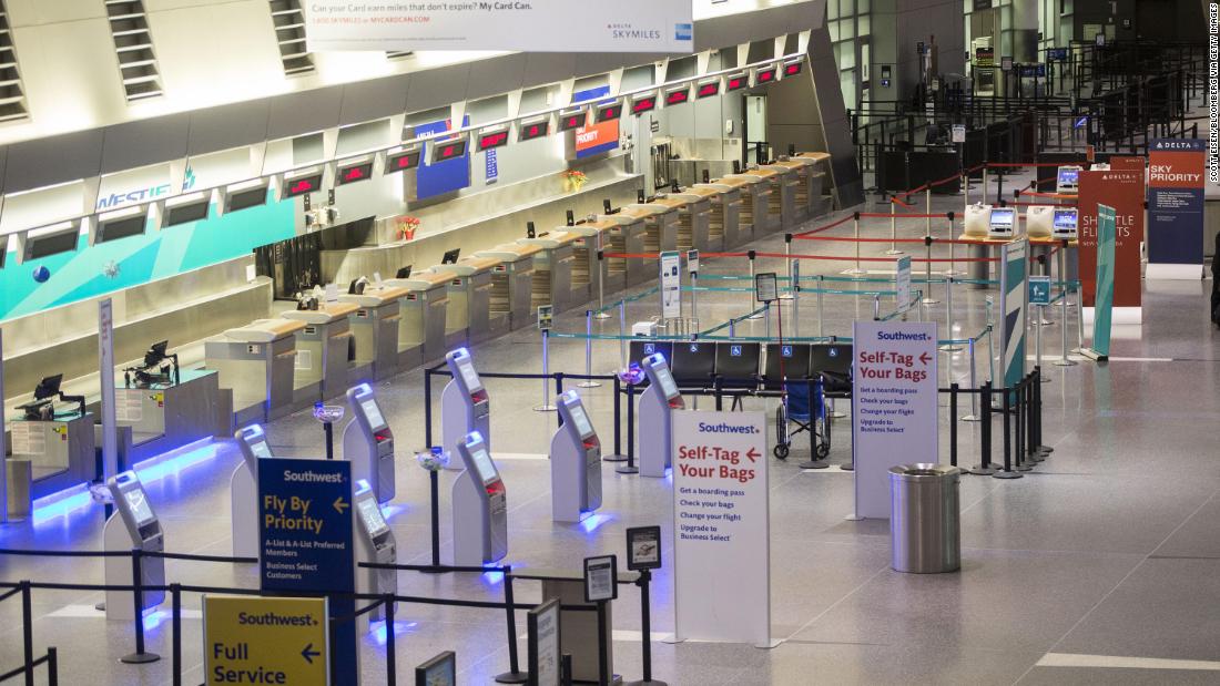 A check-in area stands empty at Boston&#39;s Logan International Airport on January 3. Thousands of flights have been canceled across the country.