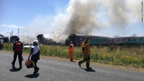 Rescue workers are seen at the site of a train crash Thursday between Hennenman and Kroonstad.