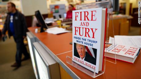 Shoppers pass the last remaining copies of the book &quot;Fire and Fury: Inside the Trump White House&quot; by Michael Wolff at a Barnes &amp; Noble store, Friday, Jan. 5, 2018, in Newport, Ky. (AP Photo/John Minchillo)