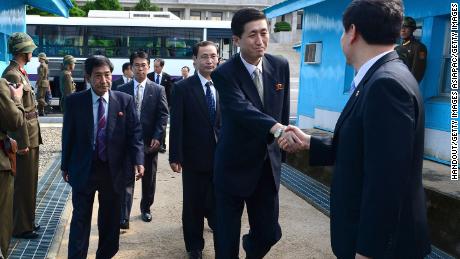 North Korean officials cross the military demarcation line (MLD) for a meeting with their South Korean counterparts on the demilitarized zone in 2013. 