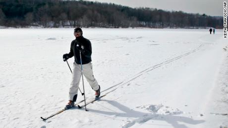 John Delcamp cross country skis along the edge of frozen Lake Arthur  in Portersville, Pennsylvania.