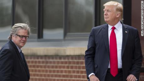 US President Donald Trump stands alongside Chief Strategist Stephen Bannon (L) upon arrival at Snap-On Tools in Kenosha, Wisconsin, April 18, 2017, prior to signing the Buy American, Hire American Executive Order.