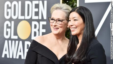 BEVERLY HILLS, CA - JANUARY 07:  Actor Meryl Streep (L) and NDWA Director Ai-jen Poo attend The 75th Annual Golden Globe Awards at The Beverly Hilton Hotel on January 7, 2018 in Beverly Hills, California.  (Photo by Frazer Harrison/Getty Images)