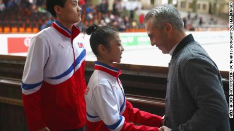 Ryom and Kim speak with Canadian coach Bruno Marcotte prior to their Pairs free skating during the 49th Nebelhorn Trophy in September 2017.