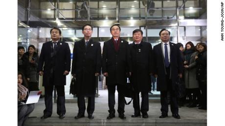 South Korean Unification Minister Cho Myoung-gyon, center, poses with other delegates before leaving for the border village of Panmunjom to attend South and North Korea meeting, at the Office of the South Korea-North Korea Dialogue in Seoul, South Korea, Tuesday, Jan. 9, 2018. (AP Photo/Ahn Young-joon)