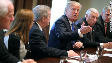 WASHINGTON, DC - JANUARY 09: U.S. President Donald Trump (C) presides over a meeting about immigration with Republican and Democrat members of Congress, including (L-R) Senate Majority Whip John Cornyn (R-TX), Rep. Martha McSally (R-AZ), Senate Minority Whip Richard Durbin (D-IL), House Minority Whip Steny Hoyer (D-MD) and House Majority Leader Kevin McCarthy (R-CA) in the Cabinet Room at the White House January 9, 2018 in Washington, DC. In addition to seeking bipartisan solutions to immigration reform, Trump advocated for the reintroduction of earmarks as a way to break the legislative stalemate in Congress. (Photo by Chip Somodevilla/Getty Images)