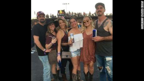 Just hours before the shooting, Rachel Sheppard, third from left, and Alaina Kelly, center in white, enjoyed the festival with thousands of other country music fans.