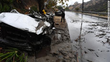 Mud fillled a Burbank street, destroyed two cars and damaged property. 