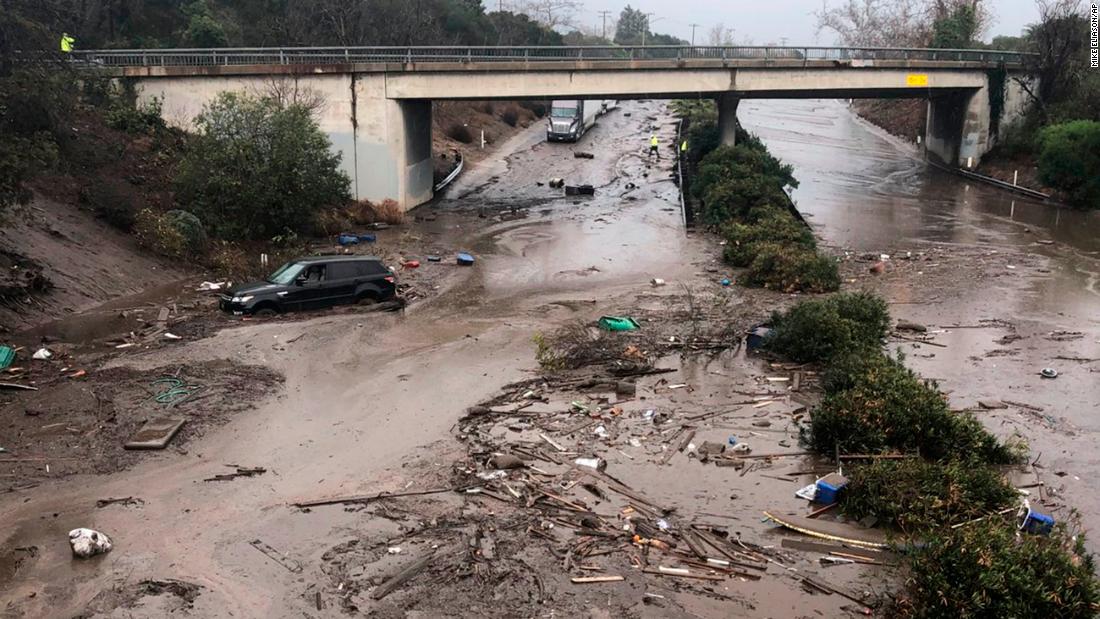 In this photo provided by Santa Barbara County Fire Department, US 101 at the Olive Mill Road overpass is flooded by Montecito Creek in Montecito, California, on Tuesday, January 9, 2018. 