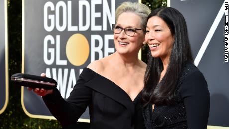 Labor activist Ai-jen Poo attends the Golden Globe Awards as a guest of Meryl Streep in 2018.