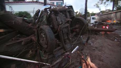 The remains of a car is jammed against muddy debris in Montecito, California, on January 9, 2018.