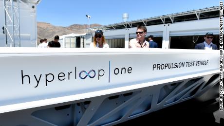 NORTH LAS VEGAS, NV - MAY 11:  People look at a demostration test sled after the first test of the propulsion system at the Hyperloop One Test and Safety site on May 11, 2016 in North Las Vegas, Nevada. The company plans to create a fully operational hyperloop system by 2020.  (Photo by David Becker/Getty Images,)