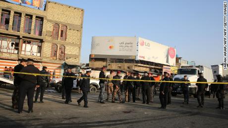 Iraqi security forces cordon off an area in central Baghdad after a deadly double suicide bombing on Monday.