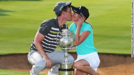 Chris Paisley of England kisses his wife Keri after winning the South African Open Championship.