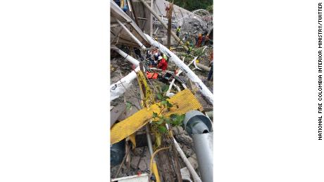 Rescue workers at the site of a collapsed bridge near Bogota, Colombia.