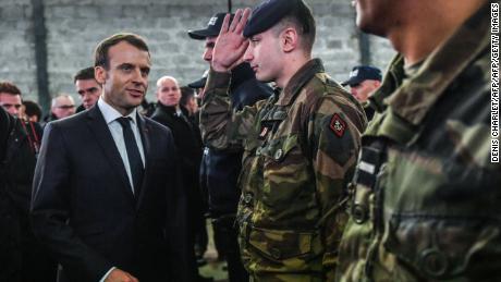 Emmanuel Macron meets security forces during his visit in the French northern city of Calais.