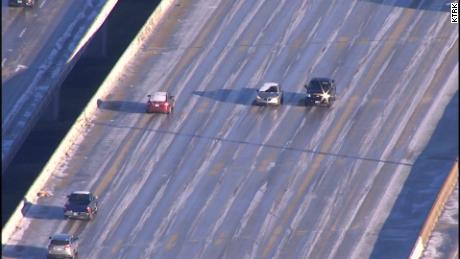 Drivers, left, intentionally head the wrong way Wednesday on a Houston highway to avoid a backup.