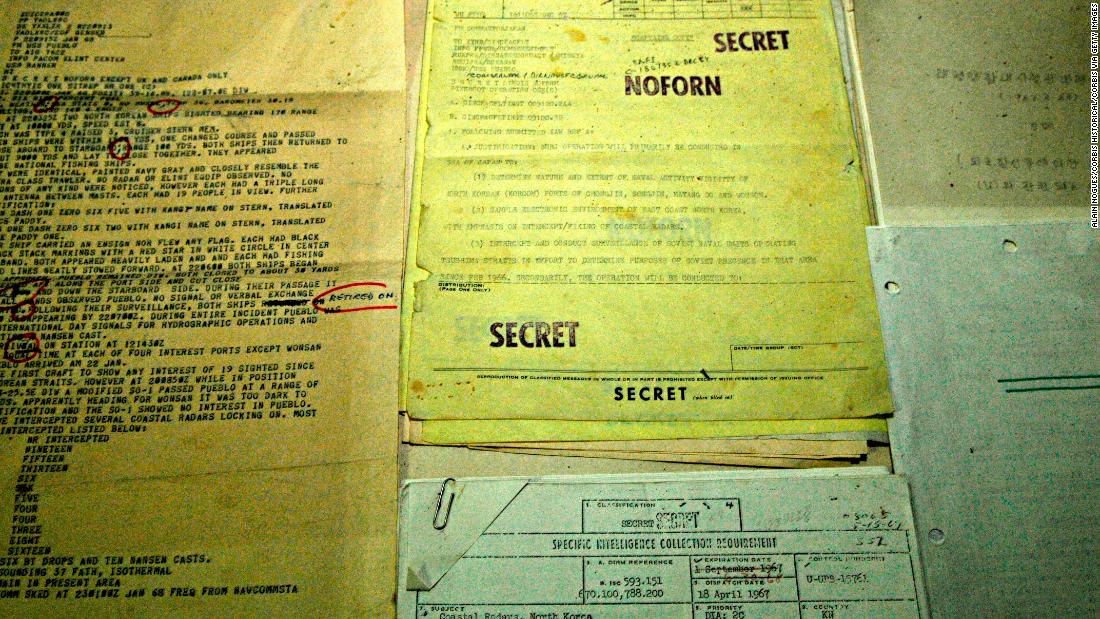 Top secret files recovered from the USS Pueblo seen in a propaganda photo released by North Korea.