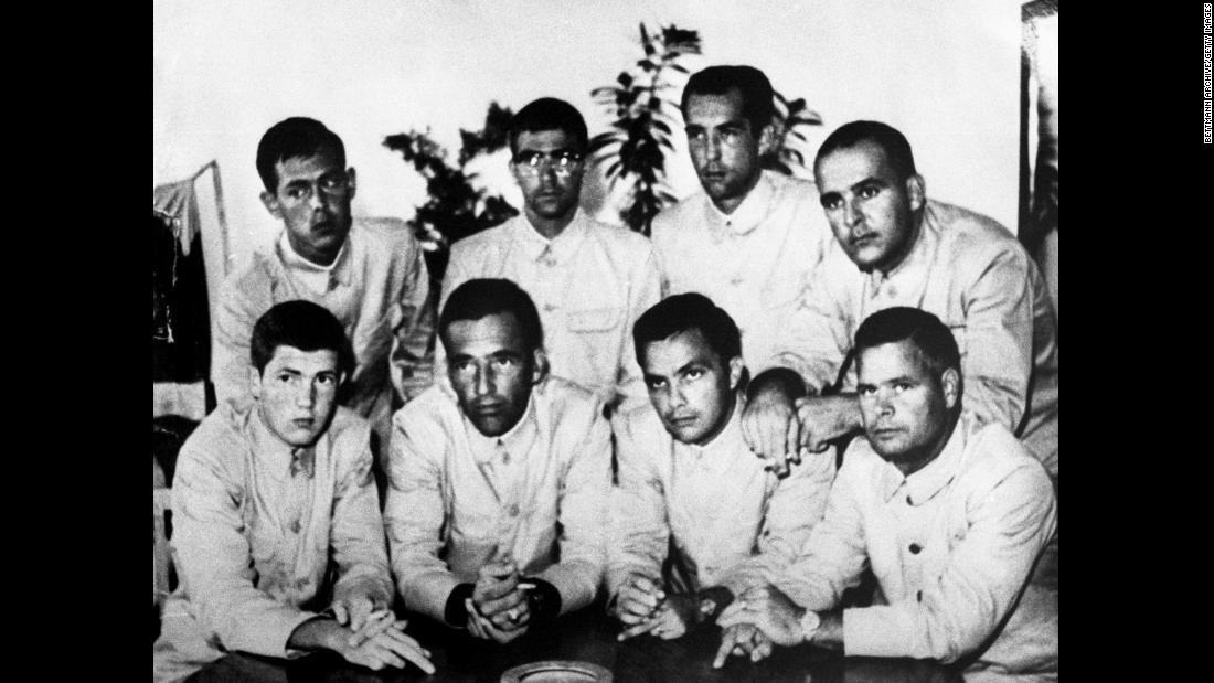 The USS Pueblo crew display their middle fingers in propaganda photos put out by their captors.