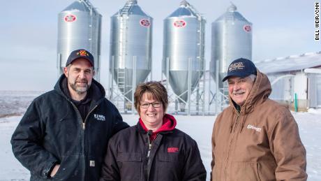 Chad, Renee and Doug Adams raise hogs and grow feed at their family farm in Monticello.