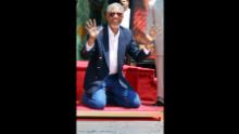 Freeman displays his hands after placing them in cement in front of Grauman's Chinese Theatre in Hollywood, in Los Angeles, in 2002.