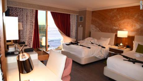 A window broken by Paddock and the interior of his hotel room.