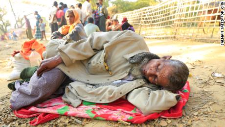 Dil Mohammad, 70,  takes a rest on the roadside near the Balukhali camp, Cox&#39;s Bazar on Saturday, January 20. He vomited after completing the treacherous  journey for Myanmar to Bangladesh.
