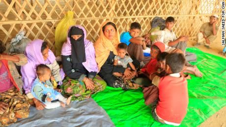 Exhausted, the newly arrived group of refugees from Buthidaung in northern Rakhine State finally reach safety at the Balukhali camp, Cox&#39;s Bazar. 